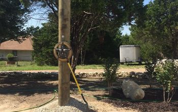 How can I make an electric pole “go away” in my landscaping?